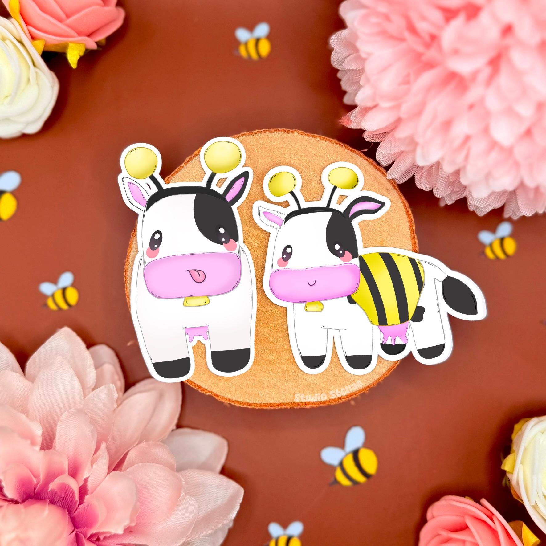 Bee cow sticker set styled on a warm brown background with pink flowers and tiny bee confetti, showing two kawaii chibi cows dressed as bumblebees. The cozy farm vibe and soft colors match MySims Kingdom nostalgia and cottagecore gamer aesthetics. This cute cow sticker set highlights crisp die cut edges and matte laminated finish, perfect for decorating laptops, planners, journals, phone cases, or water bottles as a cozy gamer gift.